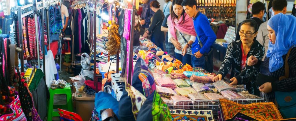 vendors in Thailand selling goods to consumers