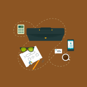 An assortment of office supplies on a brown background.