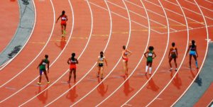 A group of track runners lined up to begin a race