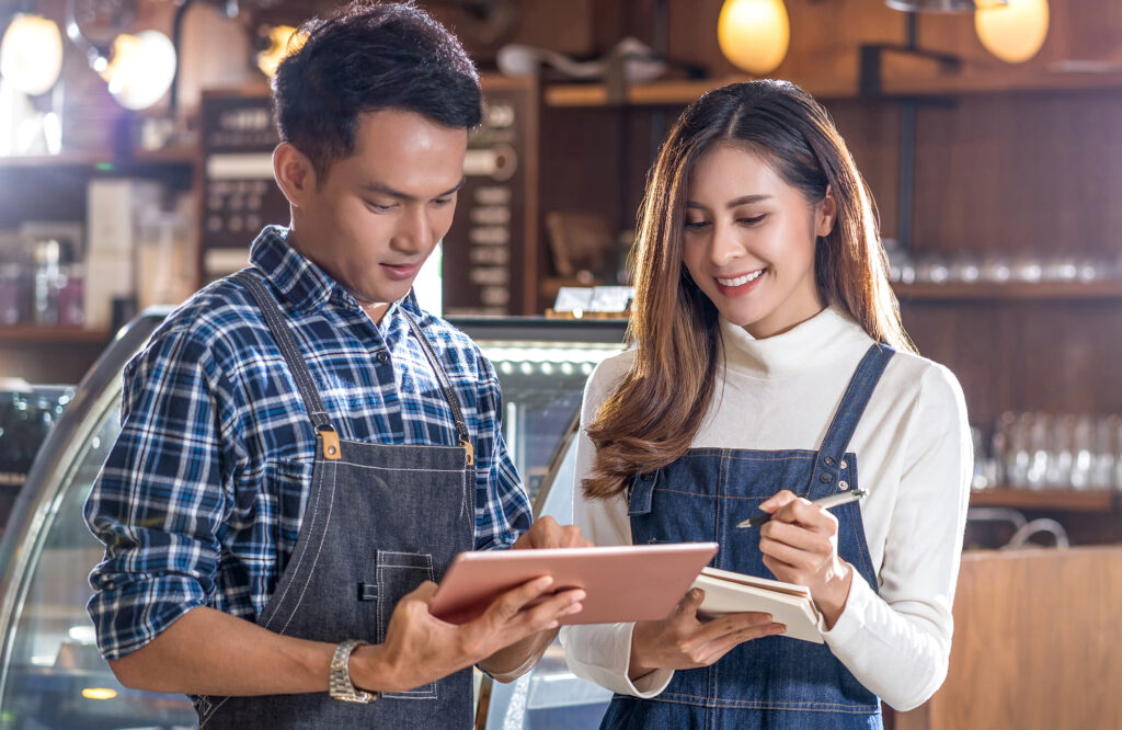 man and woman looking for money transfers provider